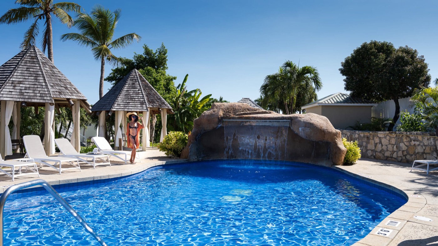 The Waterfall Pool with cabanas and a rock waterfall