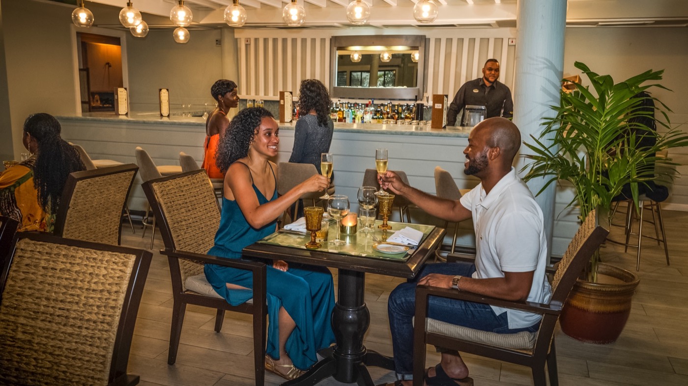 A couple celebrating over dinner